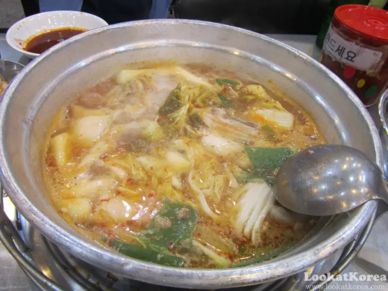 Korean Dakhanmari chicken hot pot simmering with kimchi, potatoes, and green onions