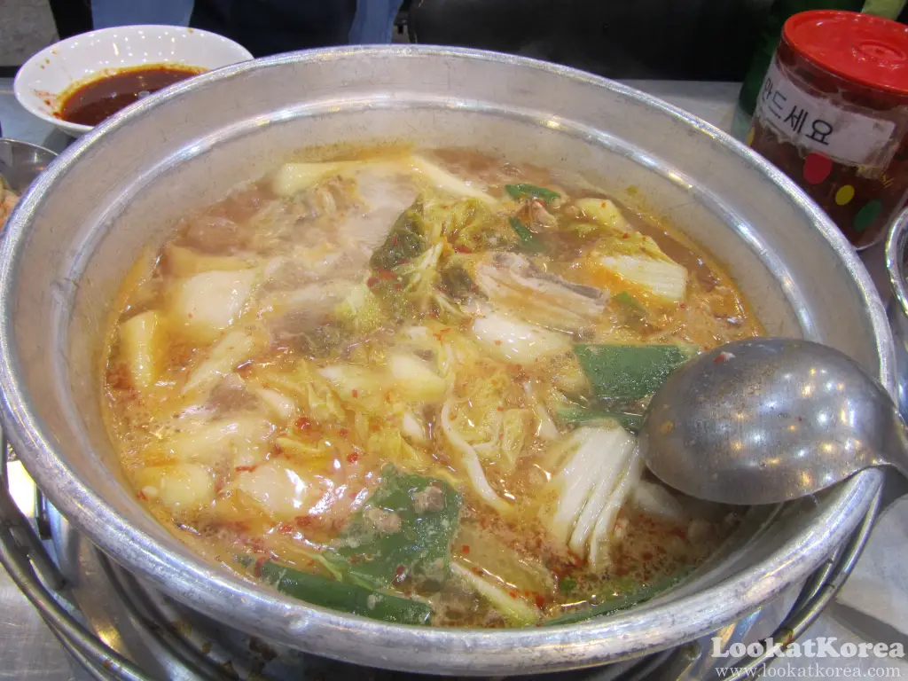 Korean Dakhanmari chicken hot pot simmering with kimchi, potatoes, and green onions