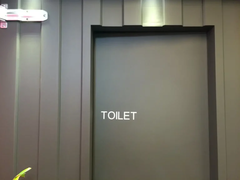 Restroom door with TOILET sign in Korea