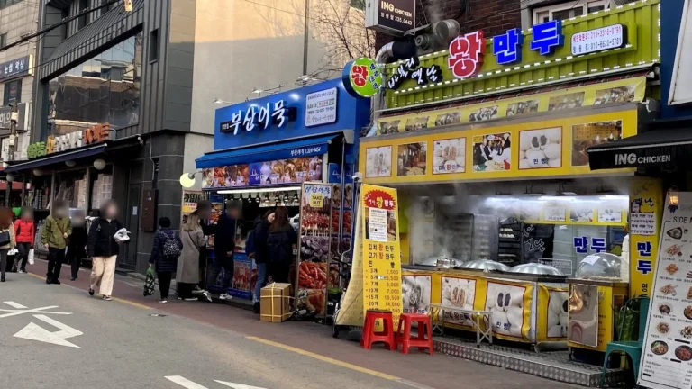 Street food stalls selling fish cakes and steamed buns on a winter day in Seoul