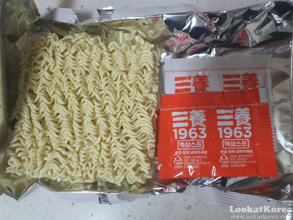 Samyang 1963 Ramen noodle block with liquid and powdered seasoning packets